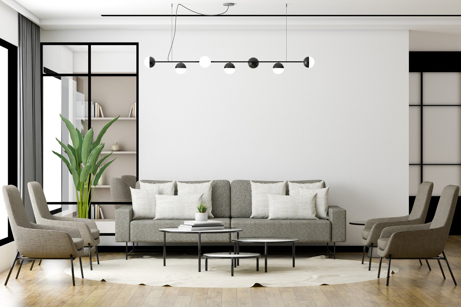 szara sofa, białe ściany, drewniana podłoga, nowoczesne oświetlenie
